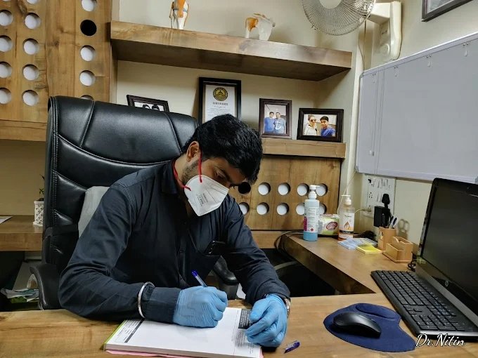 Dr. Nitin at his consultation desk